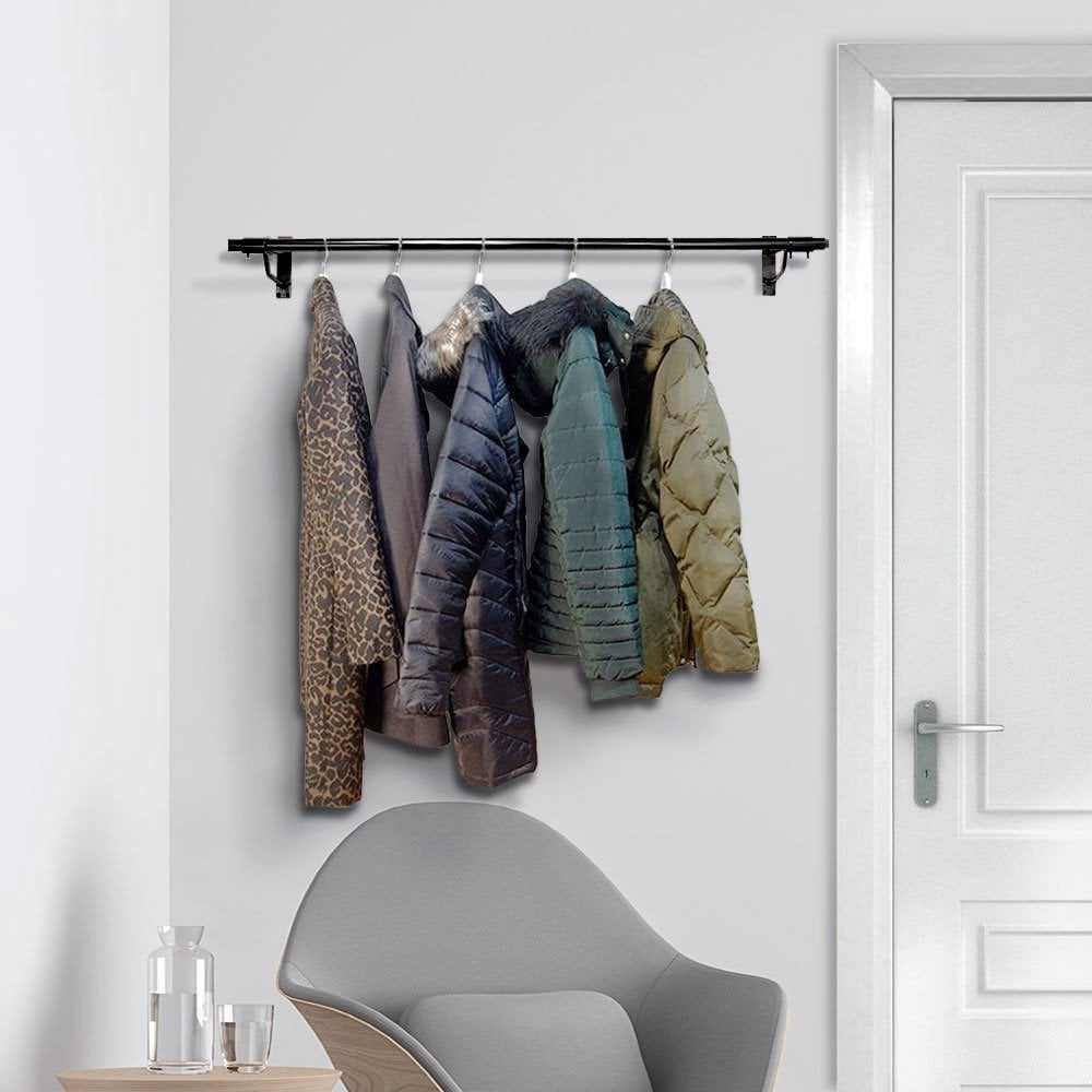 2ft wide black steel wall-mounted clothes rail with sturdy support arms for hanging garments securely.
