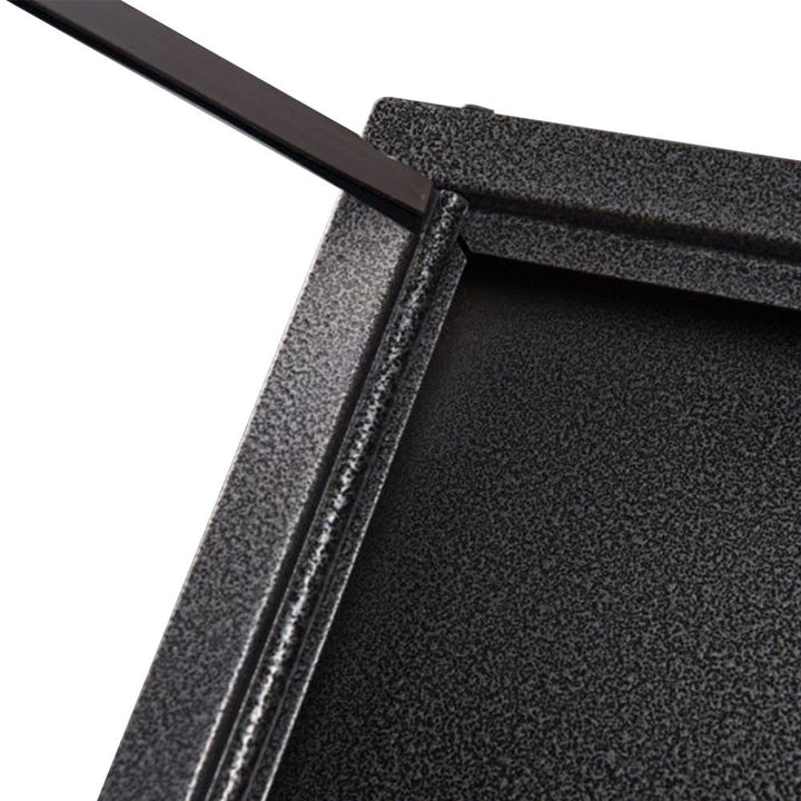Close-up of the hammered black aluminium frame corner on the 4 x A4 menu board, showing the textured hammered finish depth and the frame profile edge detail.
