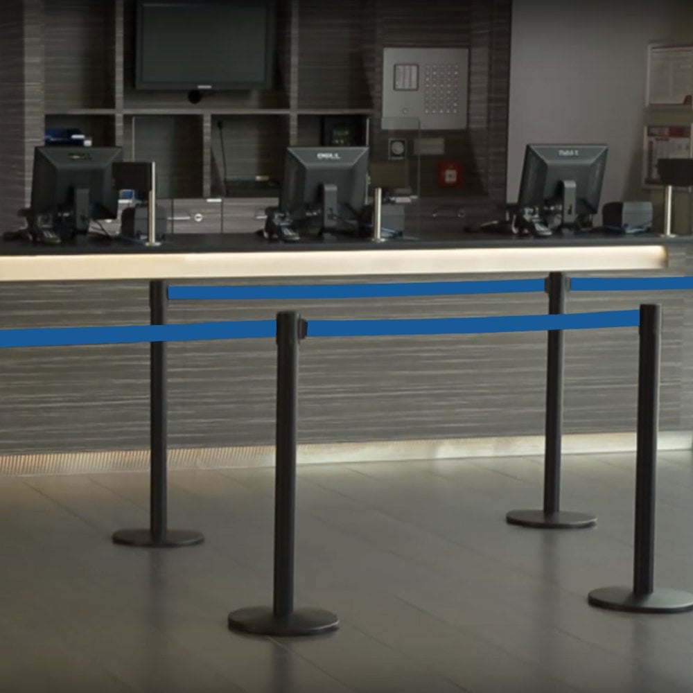 Heavy-duty advance black post with a 2.3m blue retractable belt, suitable for events, workplaces, and public spaces.
