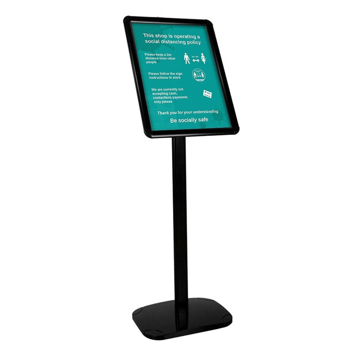 Black A3 freestanding snap frame stand with anti-glare cover and weighted round base, holding a public notice poster on a white background.
