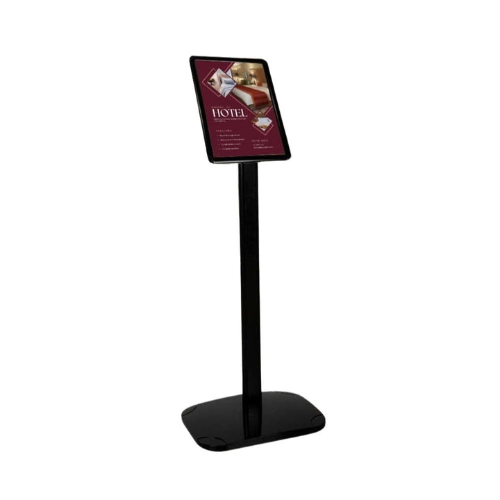 Black A4 freestanding snap frame stand with weighted base and anti-glare UV cover, on a white background with a hospitality poster loaded.

