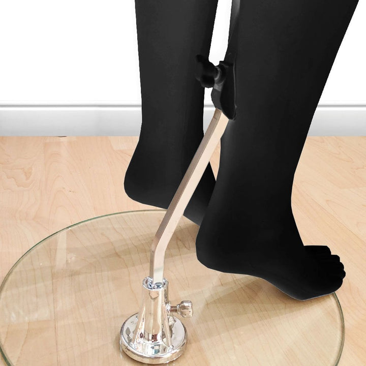 Elegant upright female mannequin in a matt black finish with a minimalist egg head design for fashion displays.
