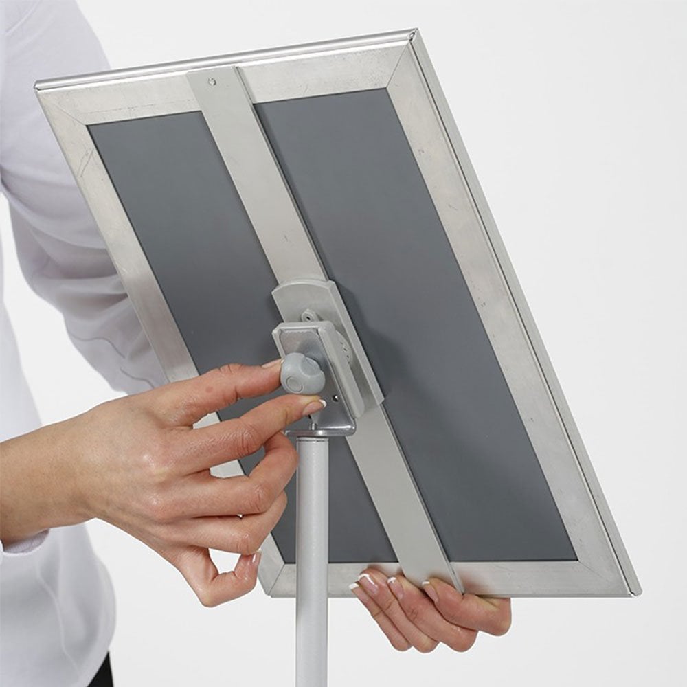 Freestanding A3 silver aluminium poster stand with an adjustable snap frame and telescopic pole, ideal for exhibitions and retail, 327mm x 1428mm.
