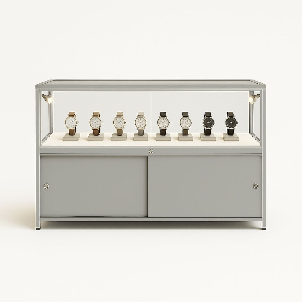 Modern aluminium glass counter display cabinet in silver, featuring four LED spotlights and a secure lockable storage compartment, 1200mm x 600mm.

